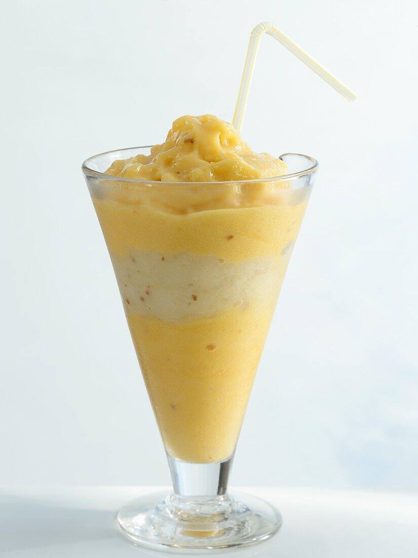 Mango and pear smoothie in a glass