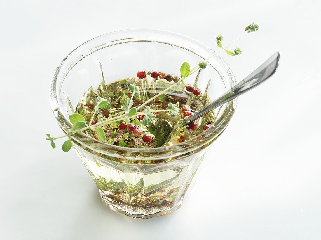 Grapeseed oil vinaigrette with pink pepper and herbs