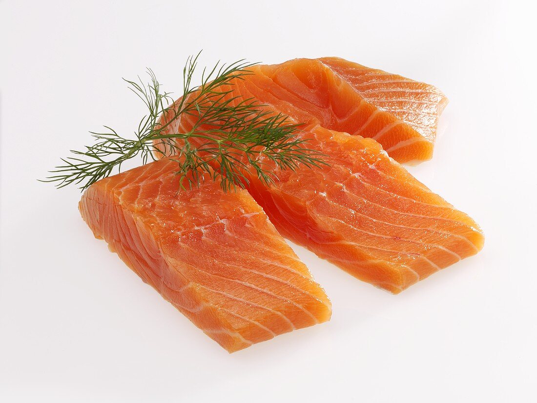 Raw salmon fillets with dill