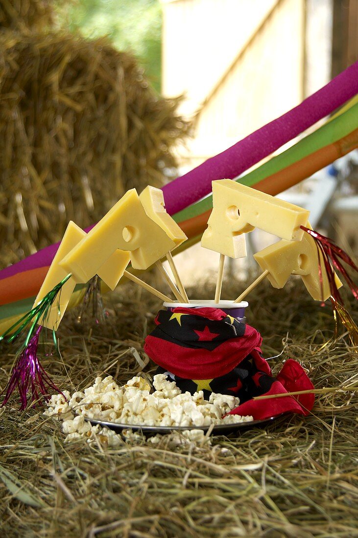 Pistol-shaped cheese sticks and popcorn for a children's party