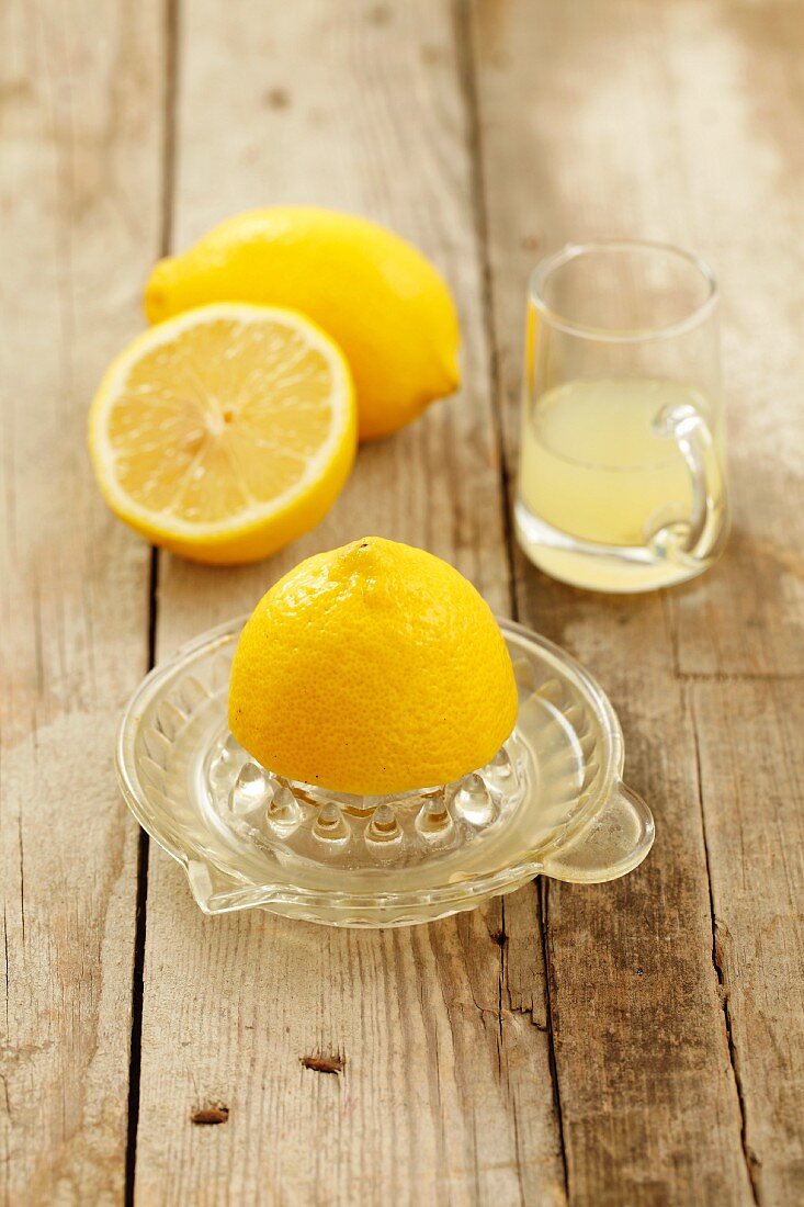 A juicer, lemons and lemon juice