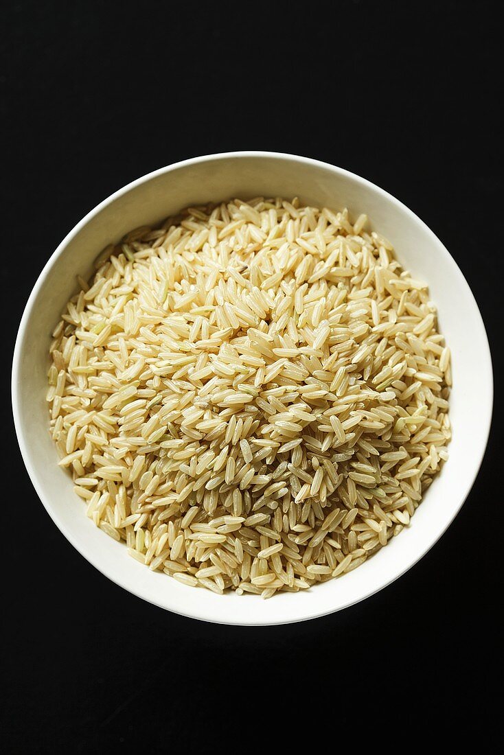 Rice in bowl by table mat