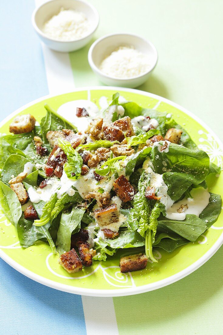 Spinach salad with croutons and Parmesan