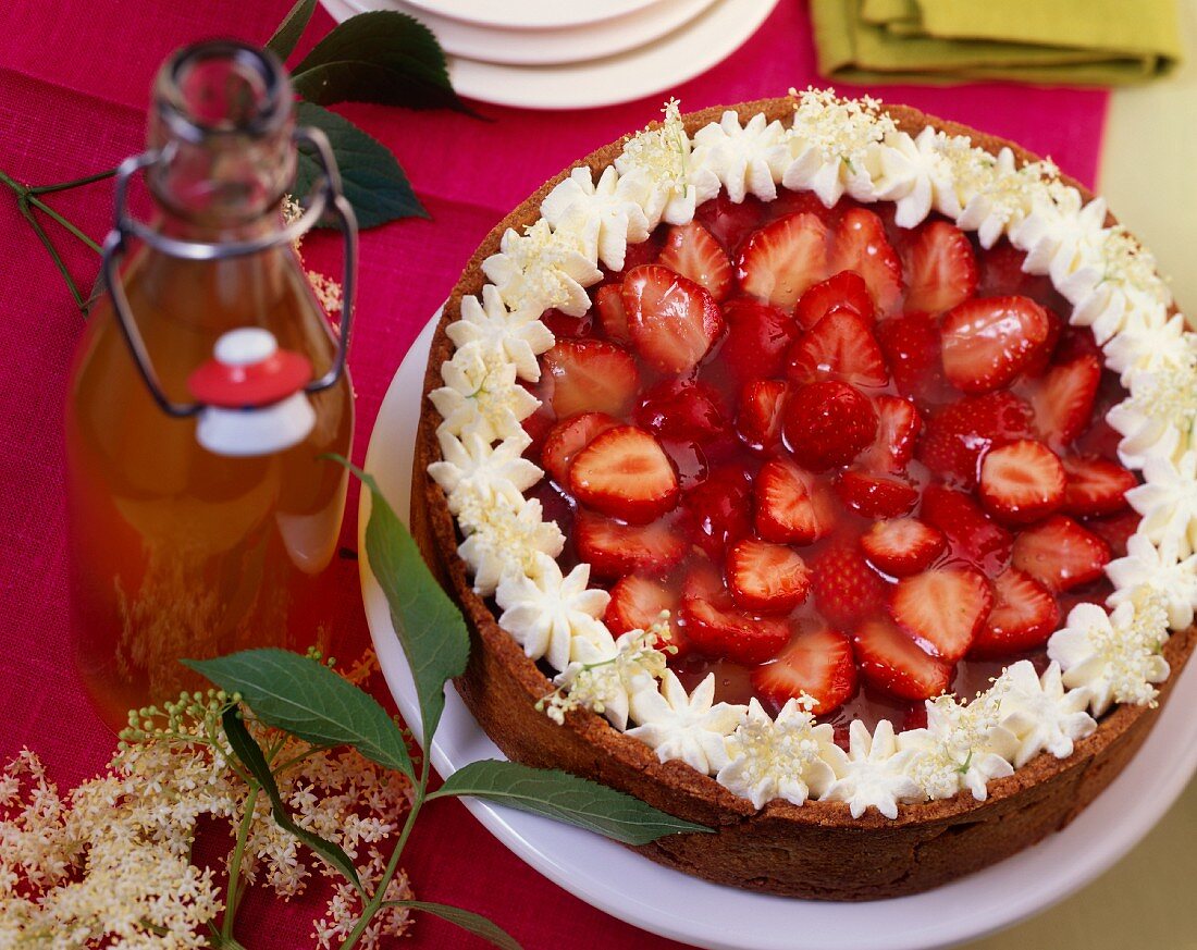 Strawberry cake with elderflower syrup