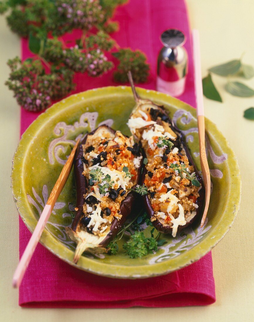 Aubergines filled with quinoa, olives and sheep's cheese