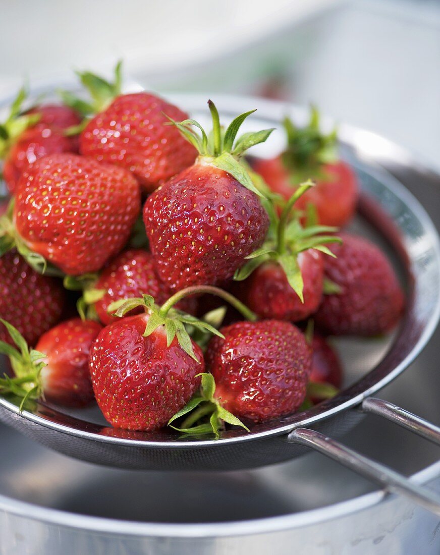 Fresh strawberries in a sieve