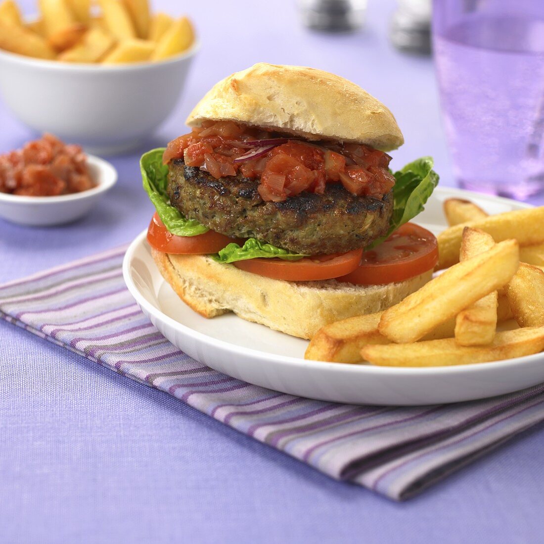 Burger with barbecue sauce and chips