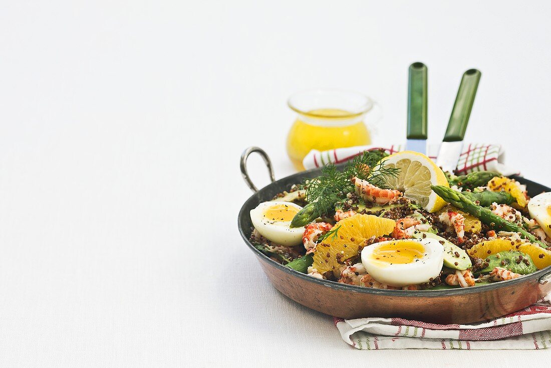 Red quinoa salad with crabmeat, asparagus and egg