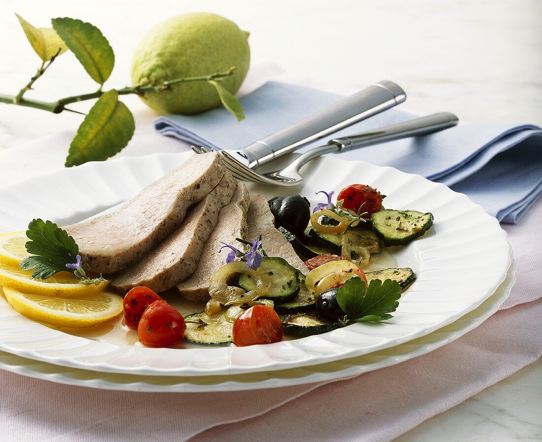 Steamed loin of veal with vegetables and lemon