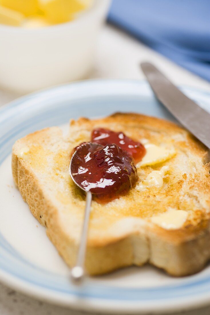 Buttered toast with strawberry jam