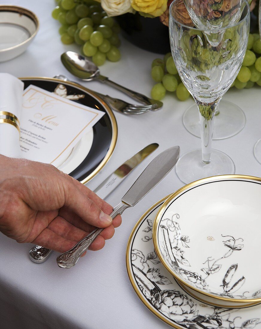 Table laid for special occasion with fish cutlery