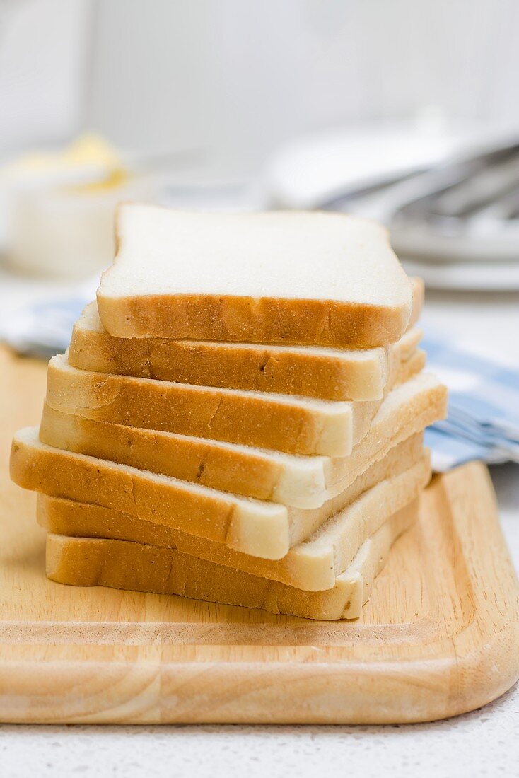 Slices of white sliced bread, stacked