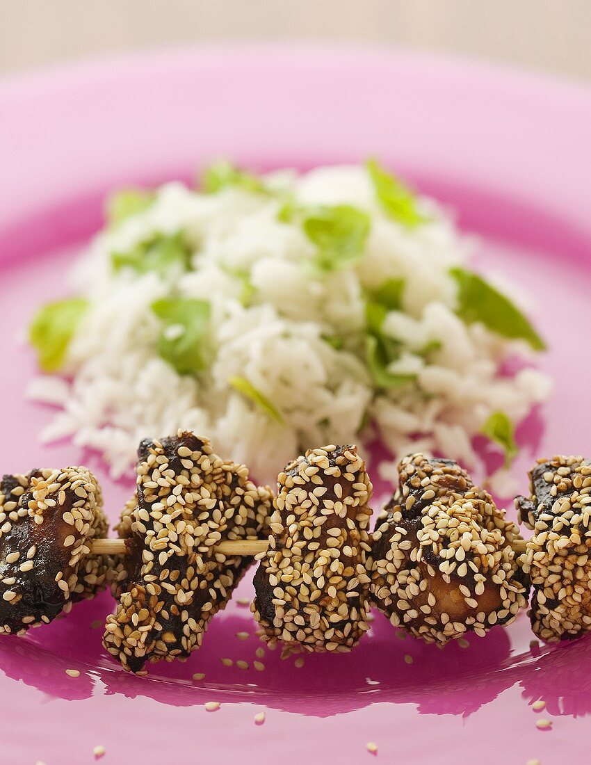 Chicken kebab with sesame seeds and minted rice