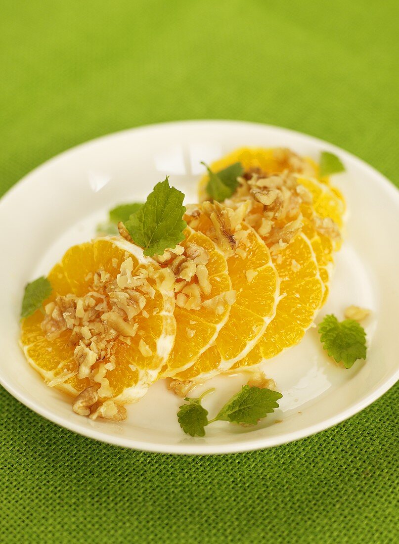 Orange slices with walnuts and mint