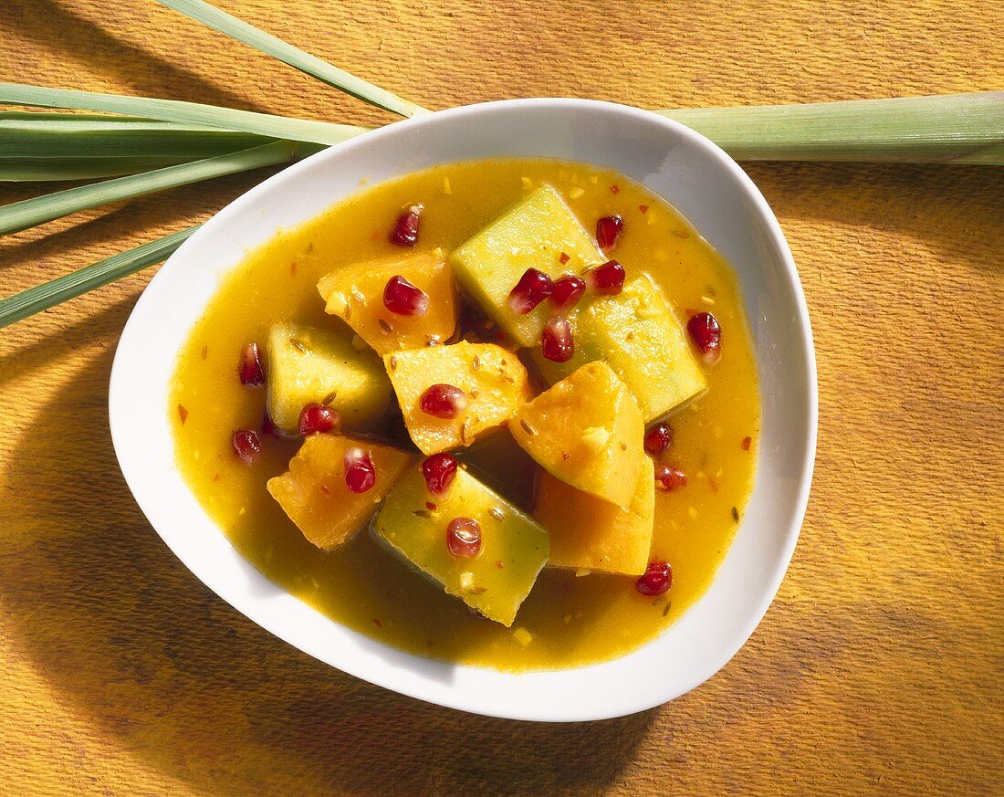 Melon curry with pomegranate seeds