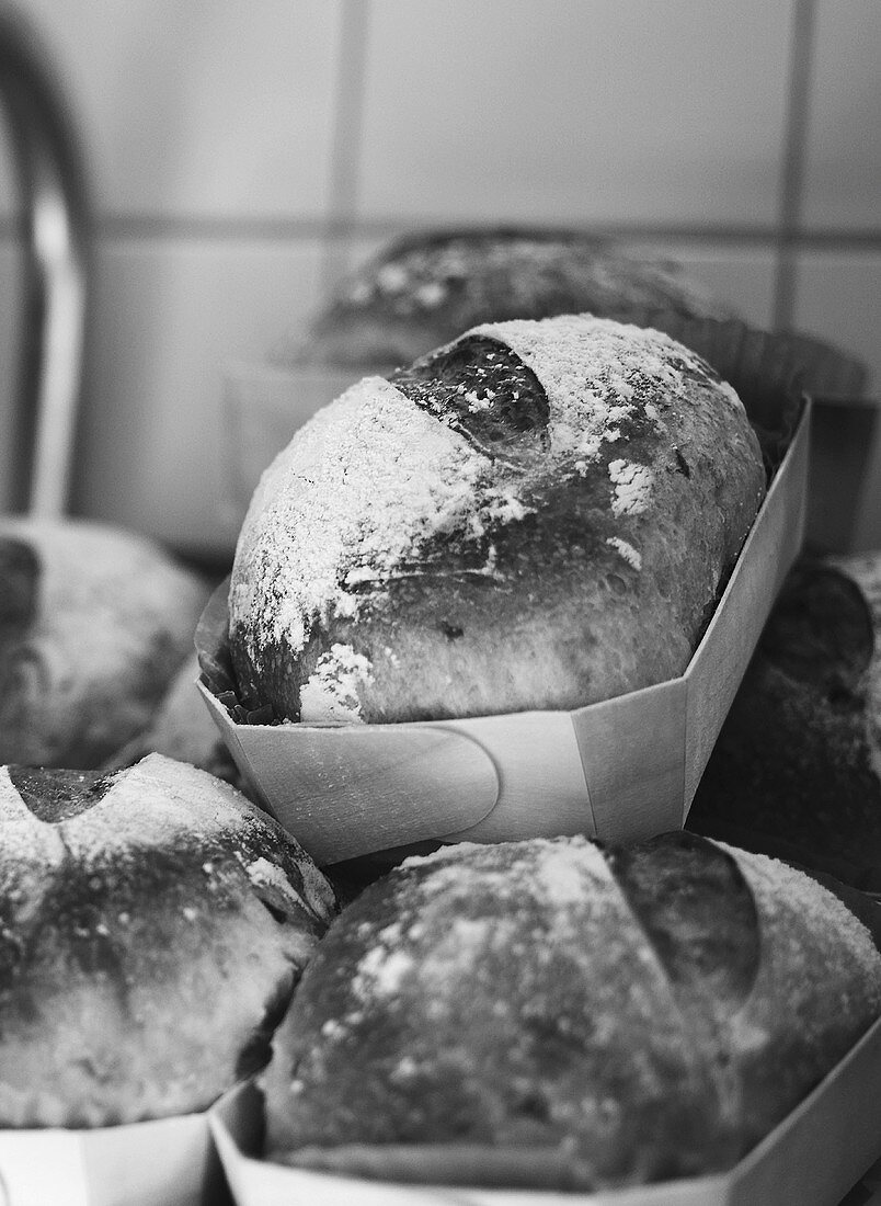 Freshly baked bread in wooden moulds