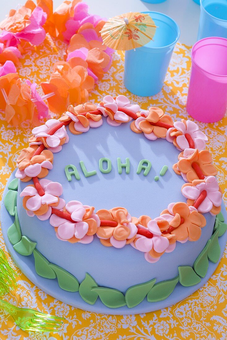 Blue marzipan cake with writing