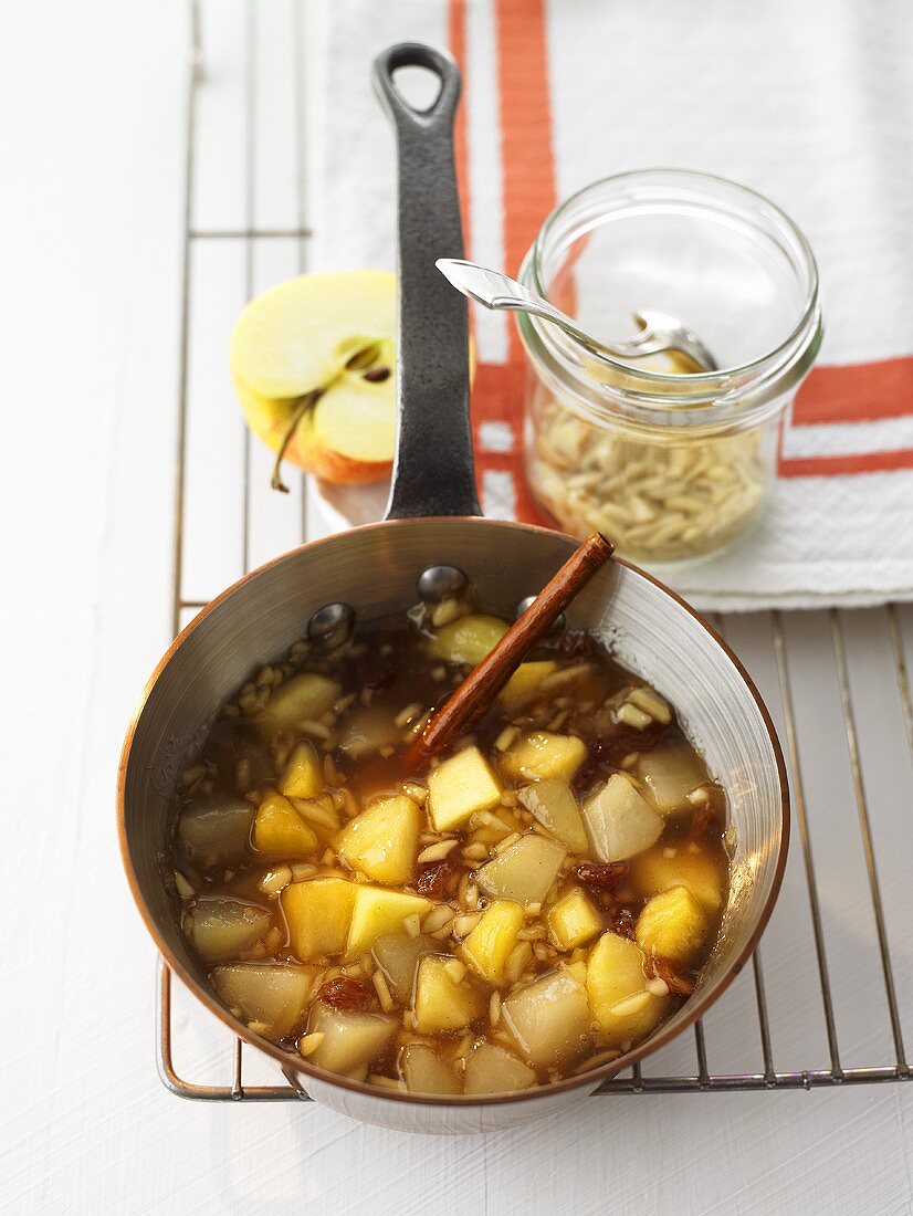 Apple and pear compote in a pan