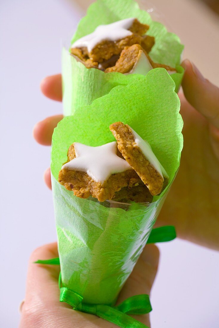 Star-shaped walut biscuits in green paper cones