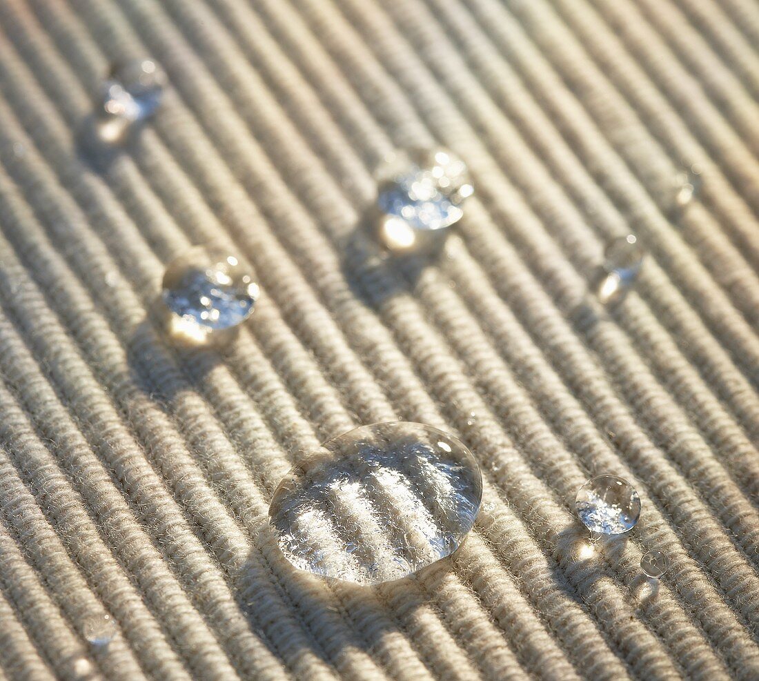 Drops of water on table mat (close-up)