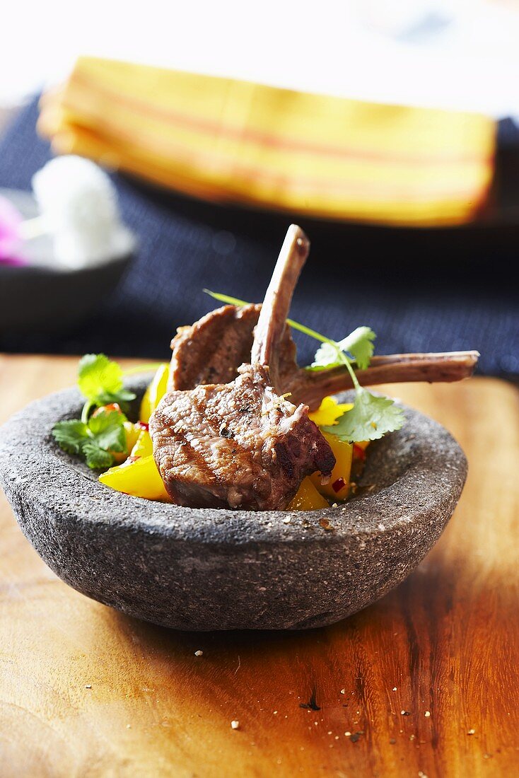 Grilled lamb chops in stone bowl