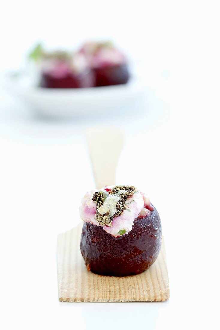 Stuffed beetroot on spatula