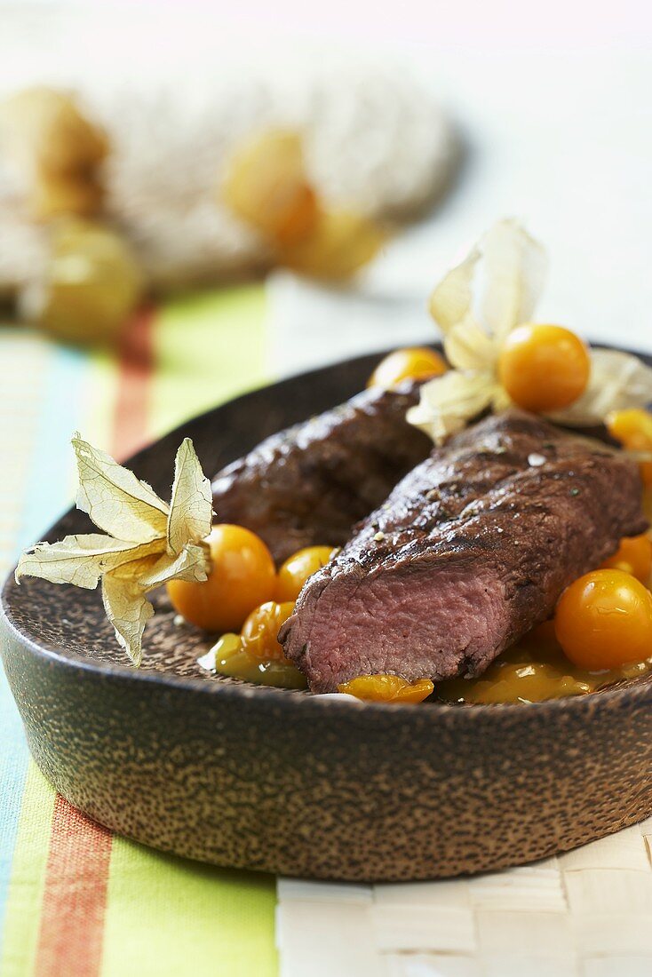 Ostrich fillets with physalis