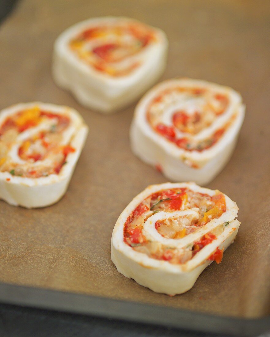 Pizza pinwheels on a baking tray