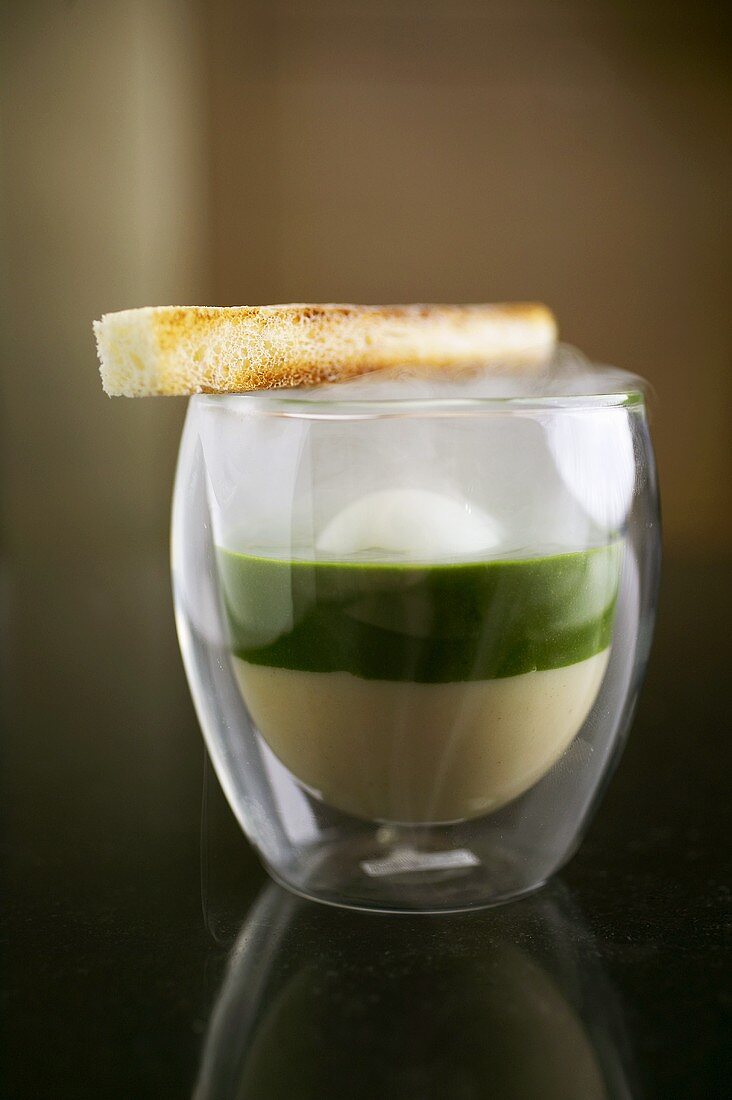 Molecular gastronomy: egg in glass, toast, nettle spinach, celery puree