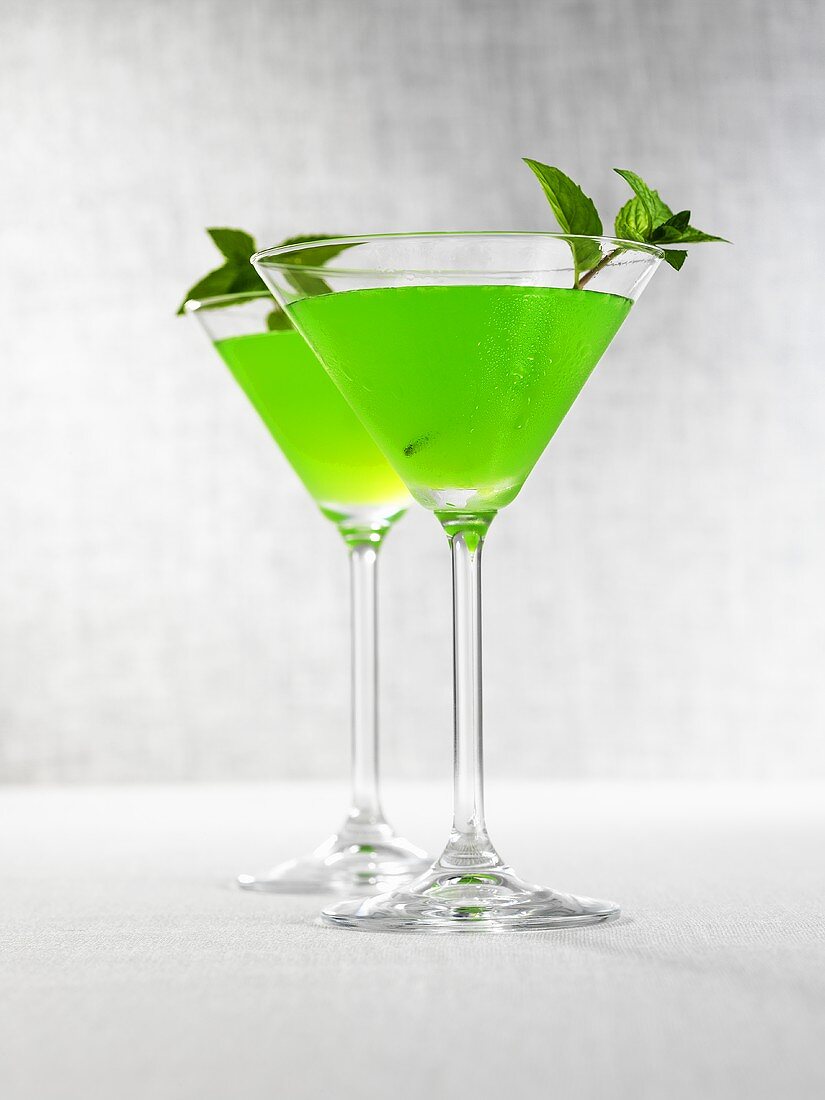 Two Melon Martinis with mint leaves