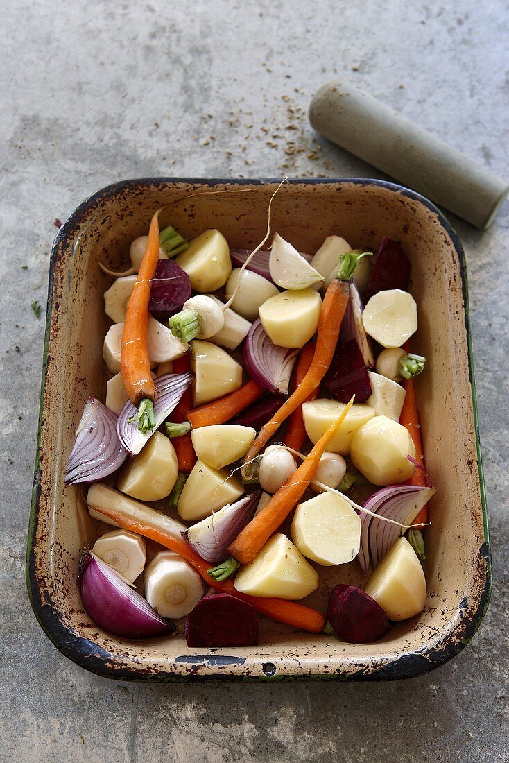 Vegetables (potatoes, carrots, onions), ready for roasting