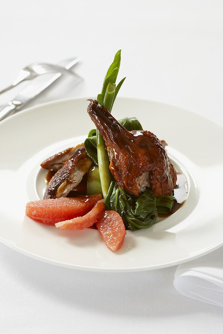 Roast duck with pink grapefruit and spring onions