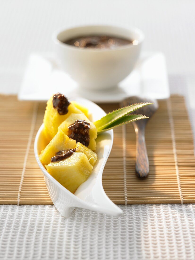 Pineapple with chocolate sauce