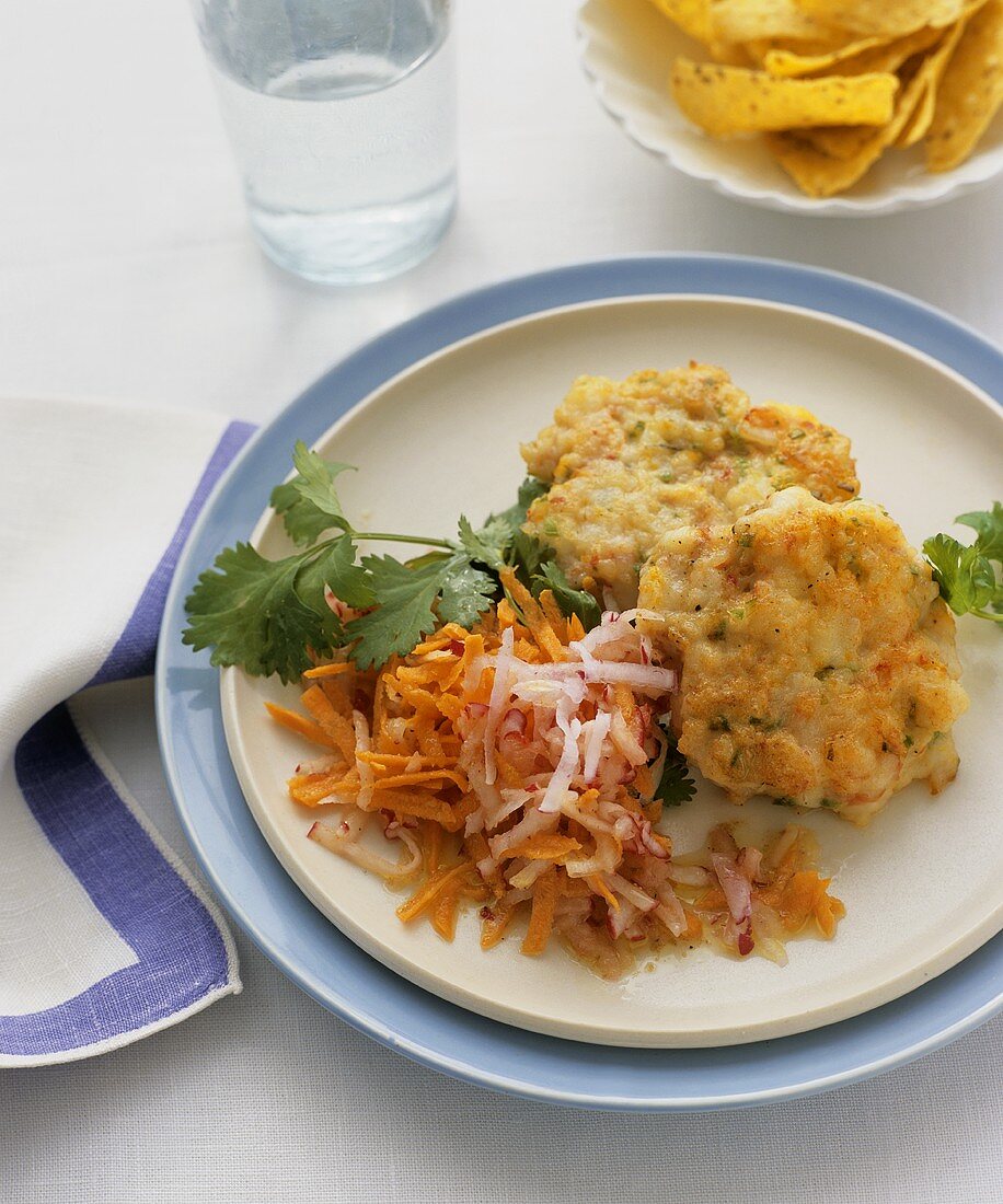 Crab cakes with carrot and radish salad