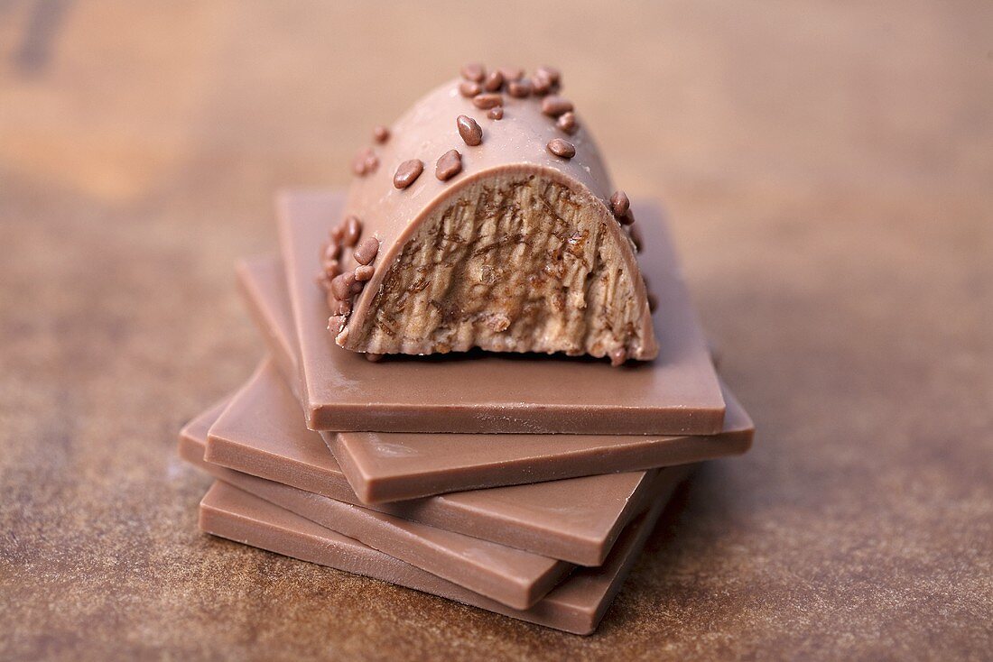 Nougat pralines on squares of chocolate
