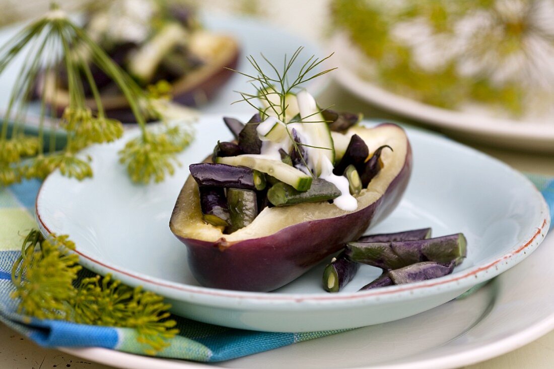 Stuffed aubergine with beans and cucumber