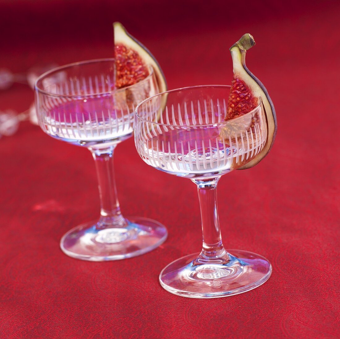 Two glasses of vodka with figs
