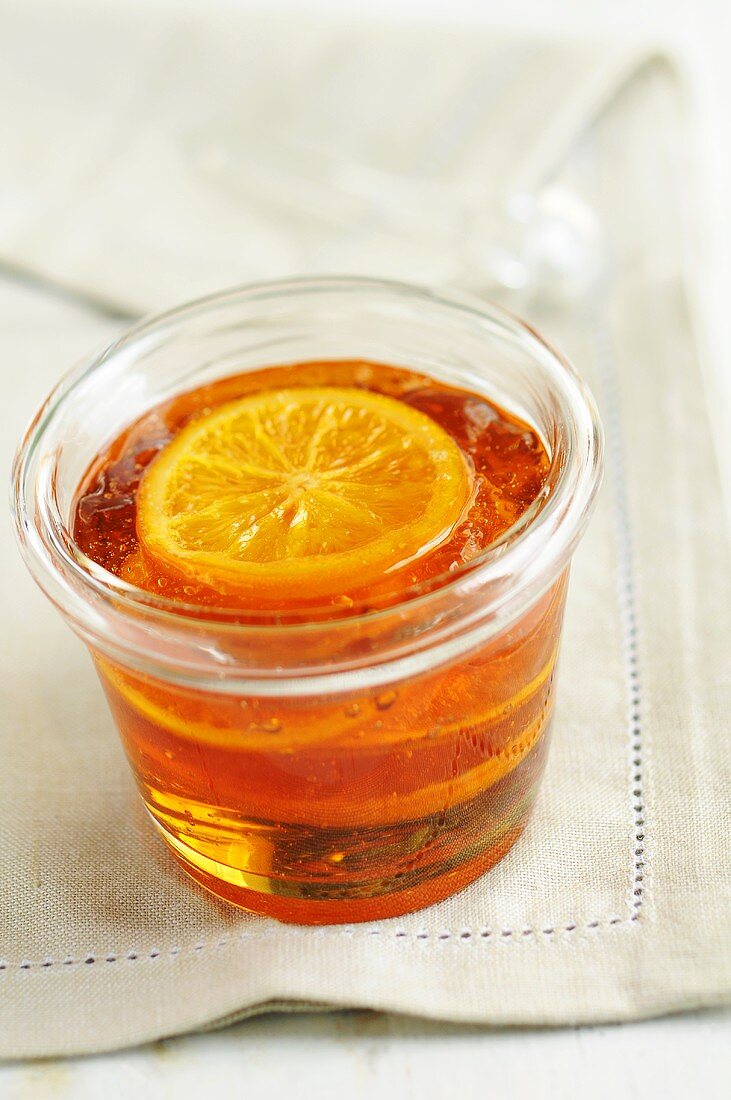 A glass of orange jelly
