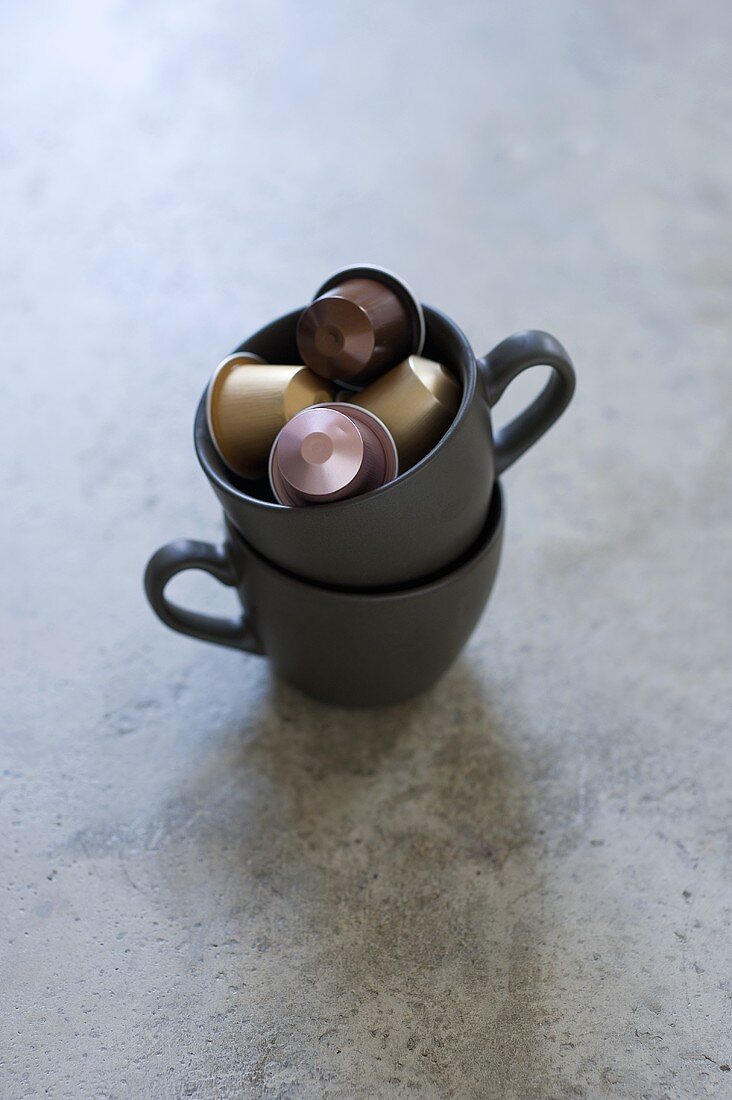 Espresso capsules in a coffee cup