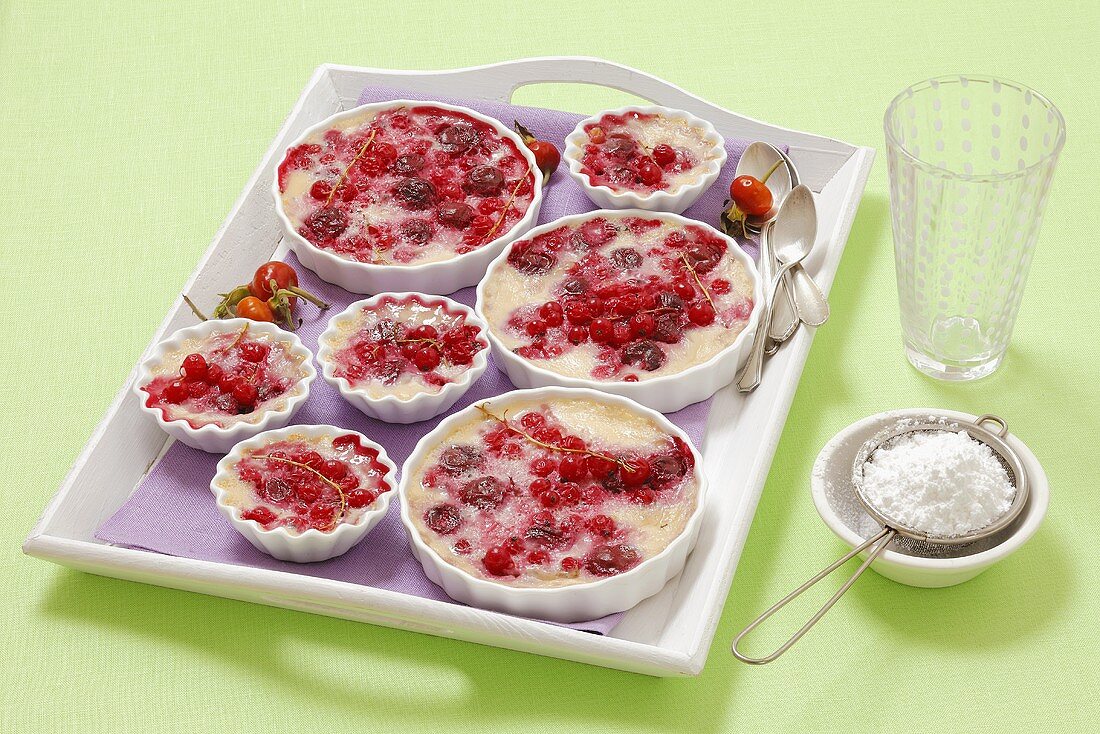 Baked vanilla cream with cherries and redcurrants