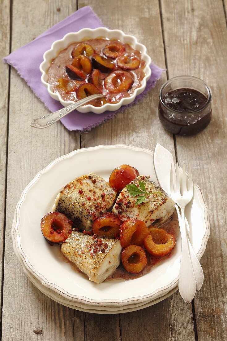 Fried hake with plums