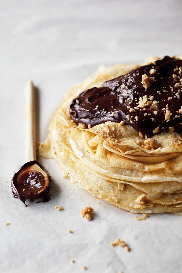Crepes with chocolate sauce and nuts