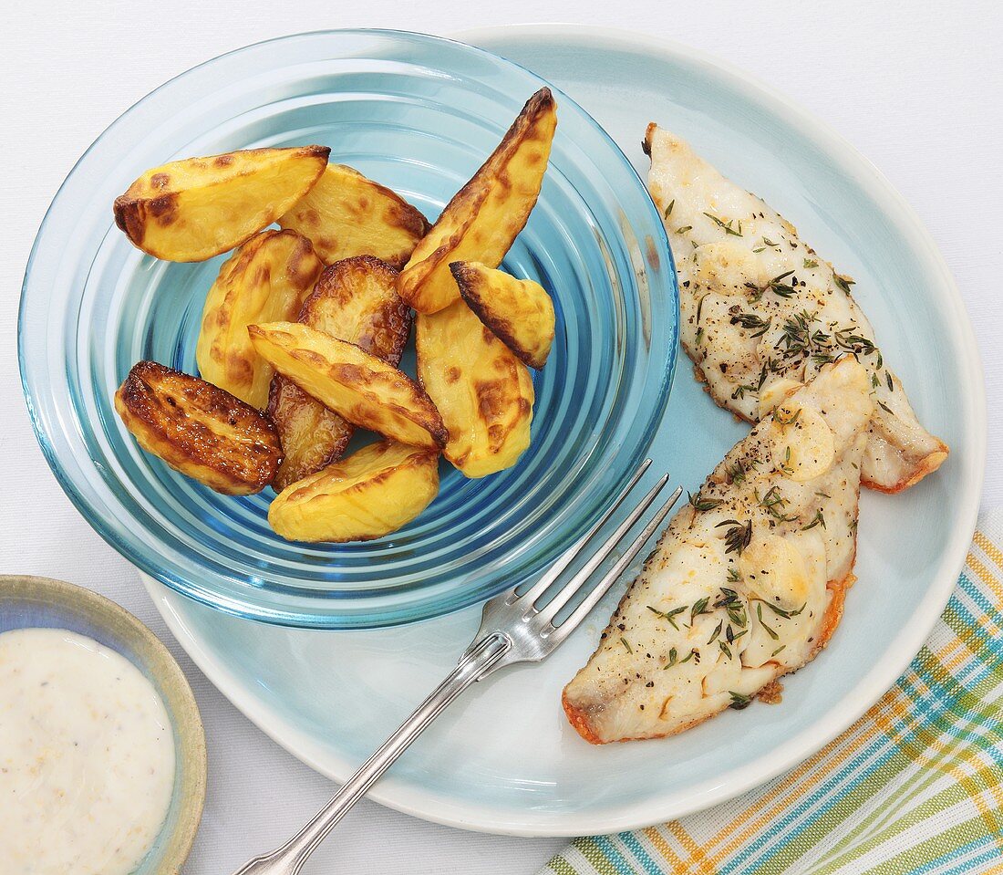 Fried fish fillets with potato wedges