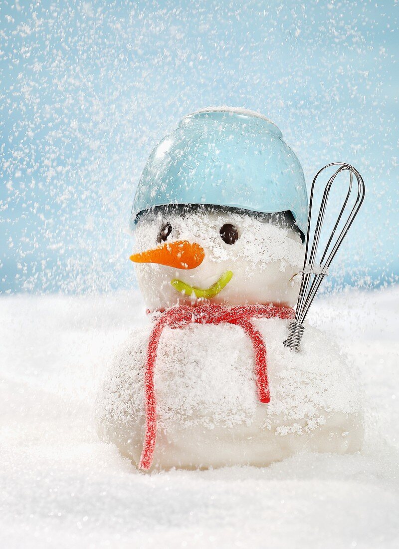 A snowman with kitchen utensils