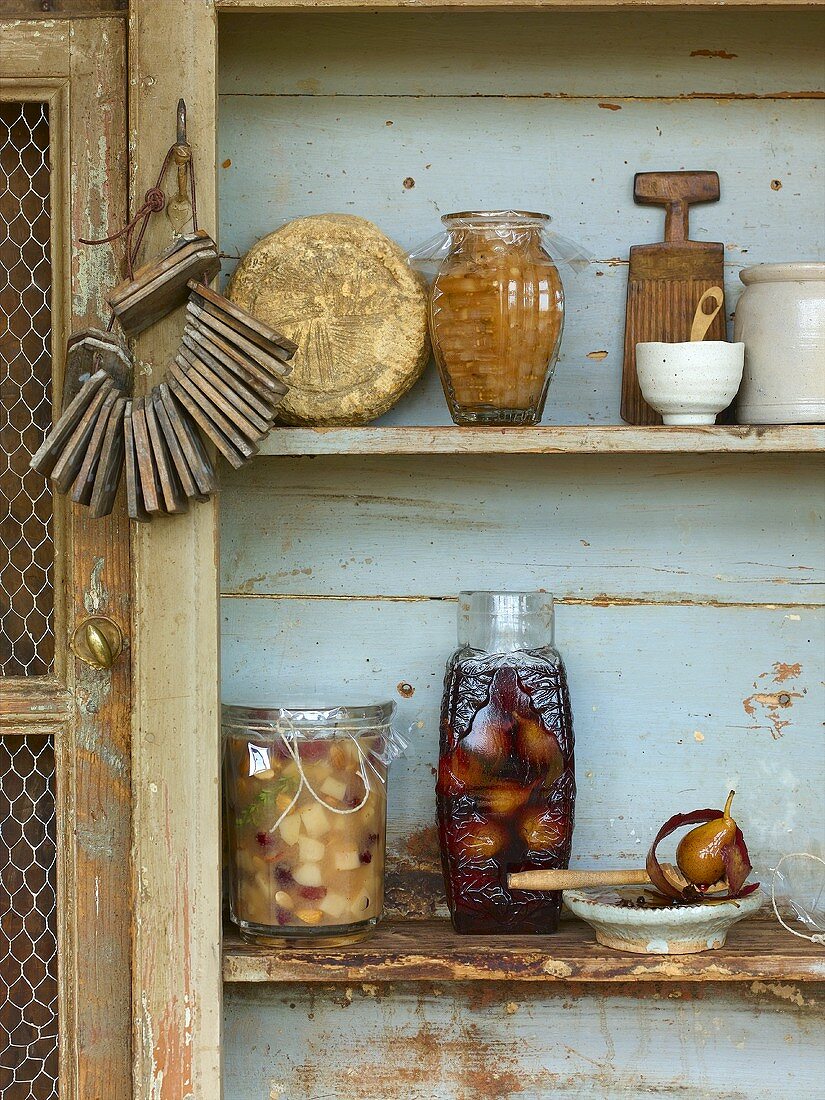 Preserved fruit on a wooden shelf