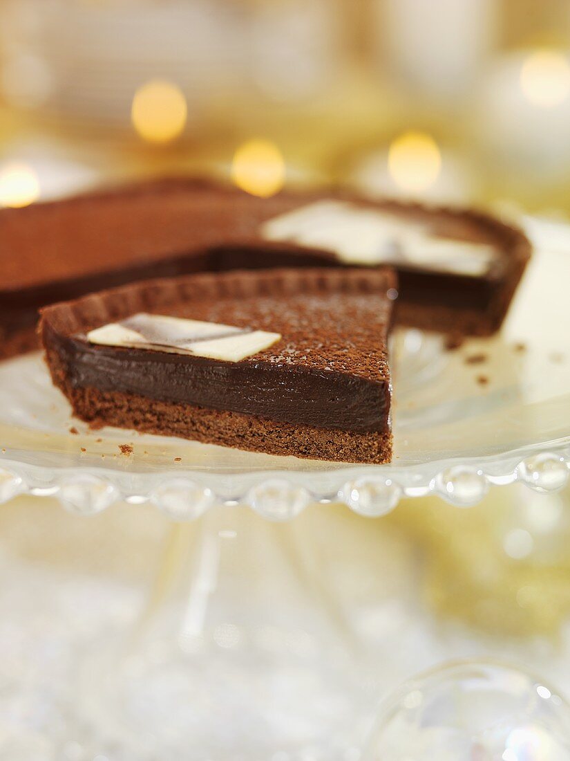 Christmas chocolate tart on a cake stand