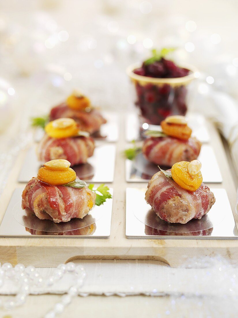 Christmas burgers wrapped in bacon with apricots and almonds
