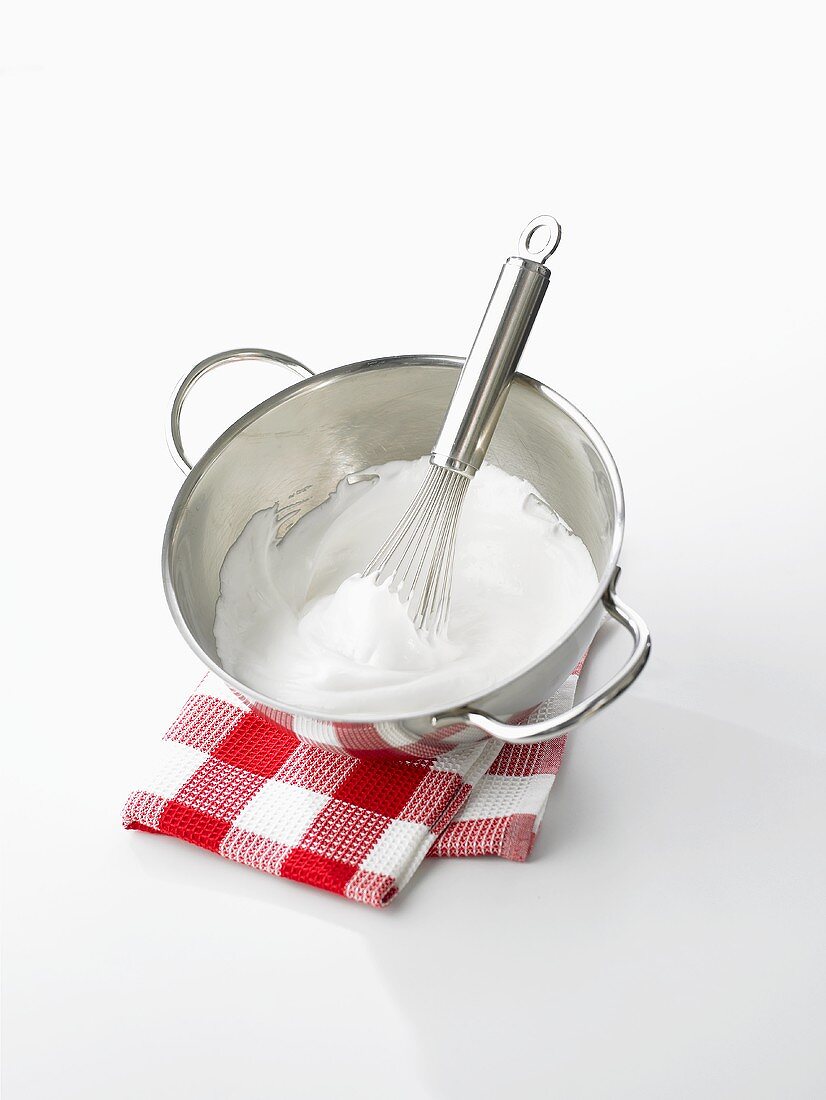 Beaten egg whites with a whisk and mixing bowl
