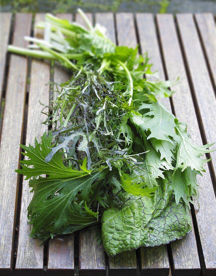 A bunch of wild herbs on a wooden table
