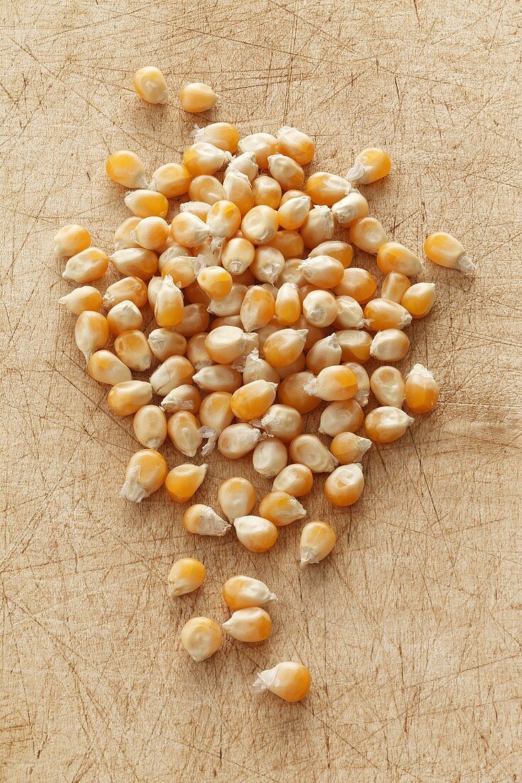 Corn kernels on a chopping board